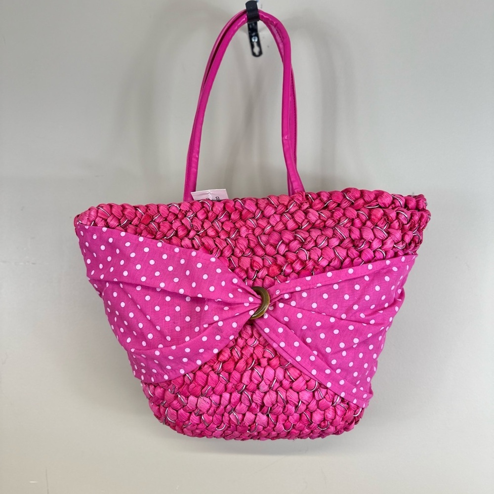 Uddini straw pink nwt 16”w 11” length. Has spot on bow